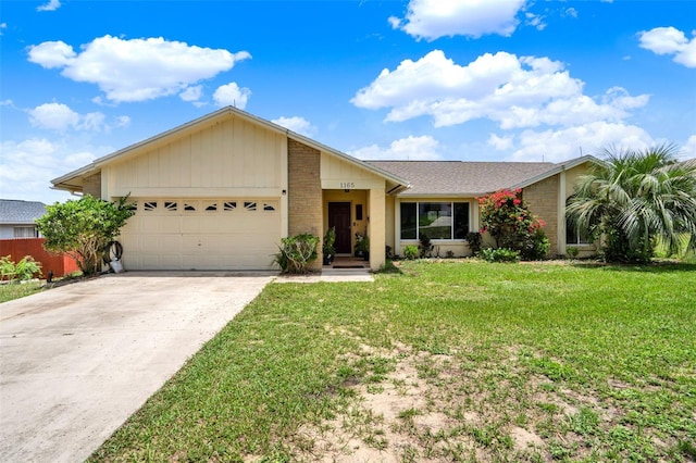 1165 Indian Ridge Trl E, Kissimmee, FL 34747 - single story home featuring an attached garage, a front yard, concrete driveway, and brick siding