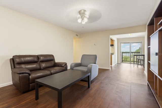 2791 L B Mcleod Rd Unit C, Orlando, FL 32805 - living room featuring a ceiling fan and dark wood finished floors