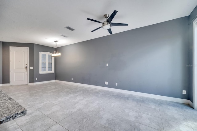 14088 Tarvin St, Orlando, FL 32832 - spare room featuring a ceiling fan, a chandelier, and light tile patterned floors