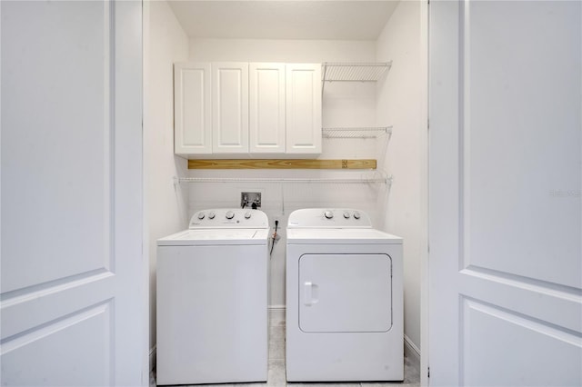 14088 Tarvin St, Orlando, FL 32832 - laundry room with washing machine and dryer and cabinet space
