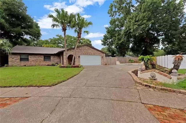 15609 Timberline Dr, Tampa, FL 33624 - view of front of home with concrete driveway and a garage