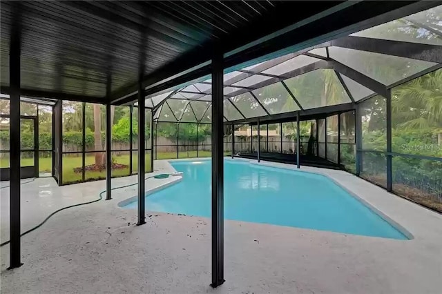 15609 Timberline Dr, Tampa, FL 33624 - outdoor pool featuring a lanai, a patio area, and a fenced backyard