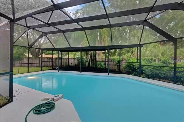 15609 Timberline Dr, Tampa, FL 33624 - view of swimming pool featuring a fenced backyard and a lanai