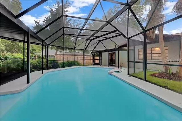 15609 Timberline Dr, Tampa, FL 33624 - view of swimming pool featuring a patio and glass enclosure