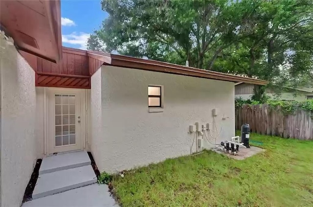 15609 Timberline Dr, Tampa, FL 33624 - view of property exterior with stucco siding and entry steps