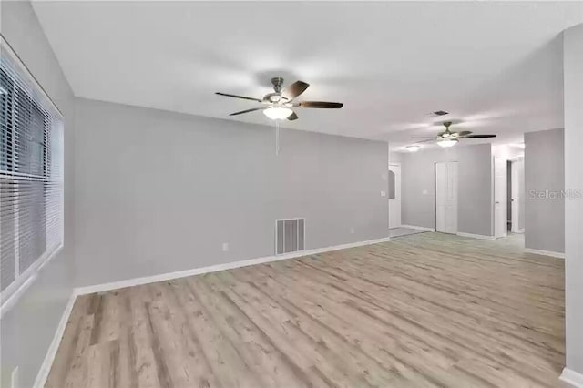 15609 Timberline Dr, Tampa, FL 33624 - unfurnished living room with a ceiling fan and wood finished floors