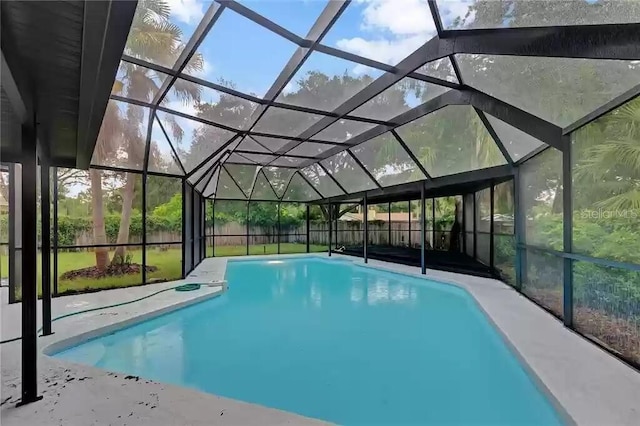 15609 Timberline Dr, Tampa, FL 33624 - view of pool featuring glass enclosure and a patio area
