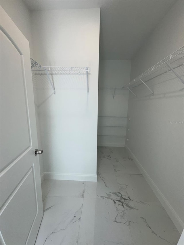 320 W Necho Ave, Lake Alfred, FL 33850 - walk in closet featuring marble finish floors