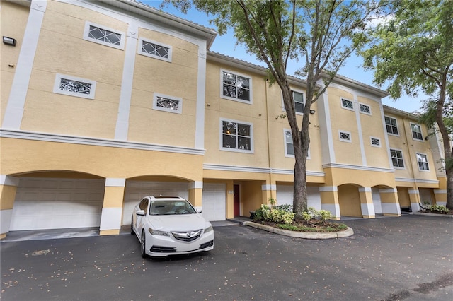 1825 Shadow View Cir Unit 1825, Maitland, FL 32751 - view of property featuring a garage and driveway