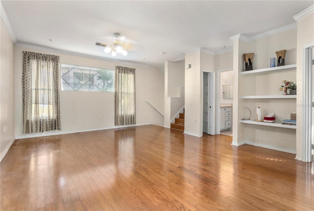 1825 Shadow View Cir Unit 1825, Maitland, FL 32751 - unfurnished living room featuring wood finished floors, ornamental molding, stairway, ceiling fan, and built in shelves