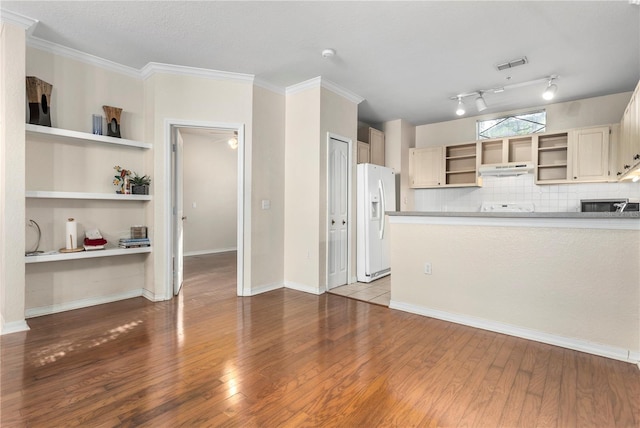 1825 Shadow View Cir Unit 1825, Maitland, FL 32751 - kitchen with open shelves, white fridge with ice dispenser, wood finished floors, backsplash, and crown molding