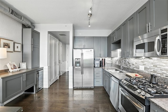 150 E Robinson St Unit 407, Orlando, FL 32801 - kitchen featuring appliances with stainless steel finishes, gray cabinets, and wine cooler
