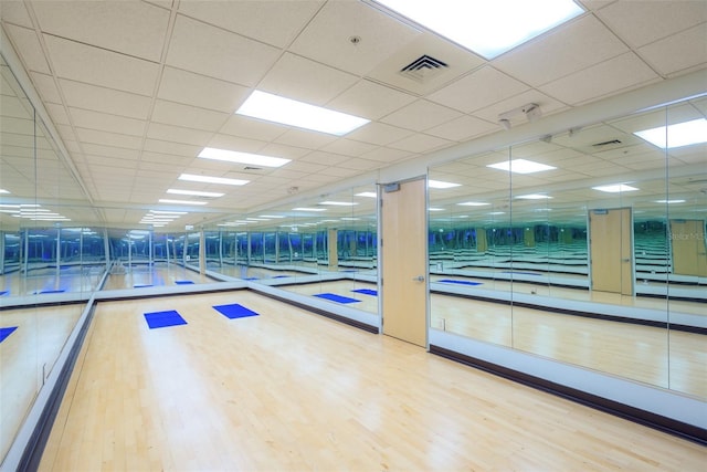 150 E Robinson St Unit 407, Orlando, FL 32801 - workout area with wood finished floors and a paneled ceiling