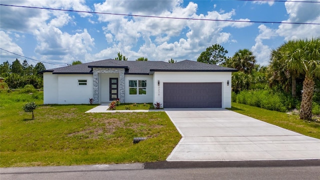 3270 Framinghan Ave SW, Palm Bay, FL 32908 - view of front of home featuring an attached garage, a front lawn, concrete driveway, and stone siding