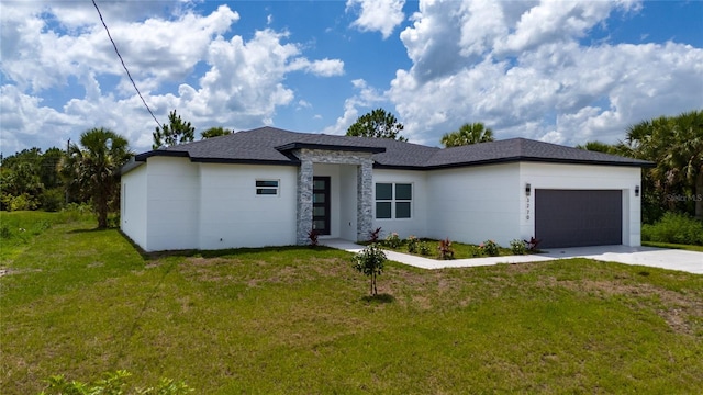 3270 Framinghan Ave SW, Palm Bay, FL 32908 - prairie-style home with a front yard, an attached garage, driveway, and a shingled roof
