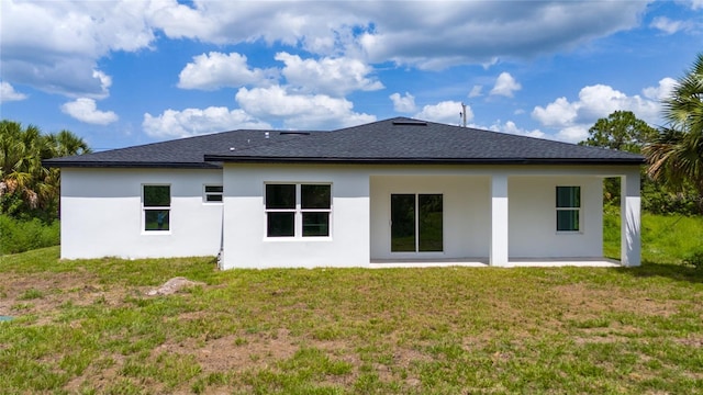 3270 Framinghan Ave SW, Palm Bay, FL 32908 - rear view of house with stucco siding, a lawn, a shingled roof, and a patio