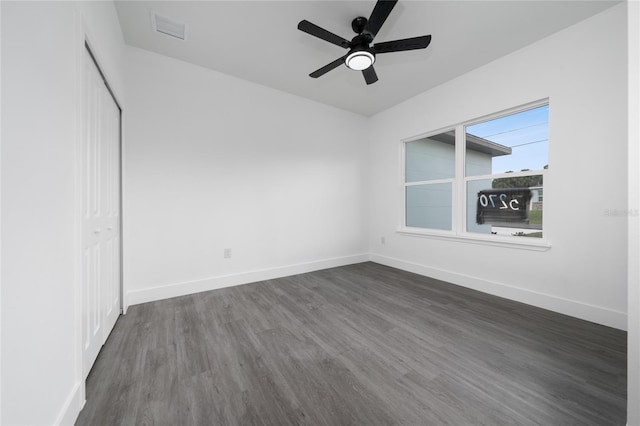 3270 Framinghan Ave SW, Palm Bay, FL 32908 - unfurnished bedroom featuring dark wood-style flooring, a closet, and ceiling fan