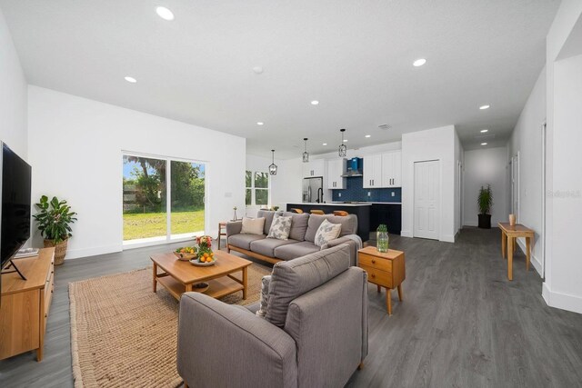 3270 Framinghan Ave SW, Palm Bay, FL 32908 - living room with dark wood-type flooring and recessed lighting