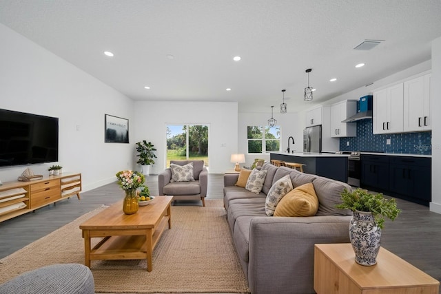 3270 Framinghan Ave SW, Palm Bay, FL 32908 - living area with light wood-style flooring and recessed lighting