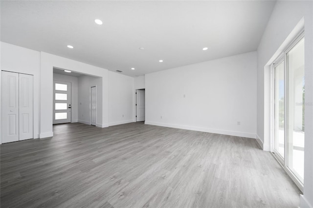 3270 Framinghan Ave SW, Palm Bay, FL 32908 - unfurnished living room with recessed lighting and wood finished floors