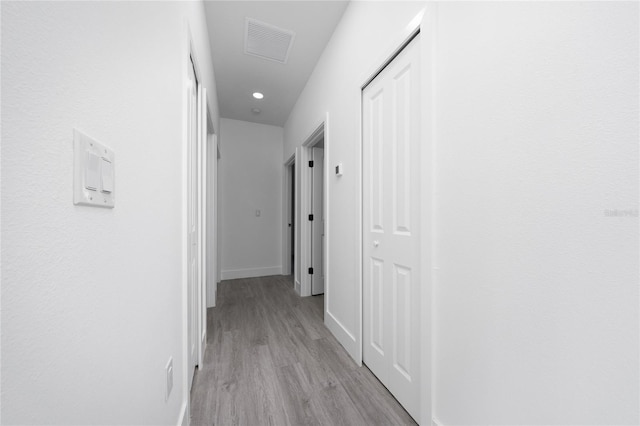 3270 Framinghan Ave SW, Palm Bay, FL 32908 - hallway featuring light wood-type flooring and baseboards