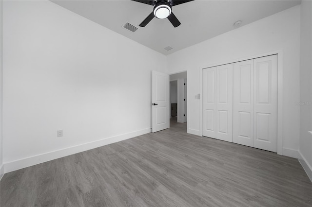 3270 Framinghan Ave SW, Palm Bay, FL 32908 - unfurnished bedroom featuring wood finished floors, a closet, and ceiling fan