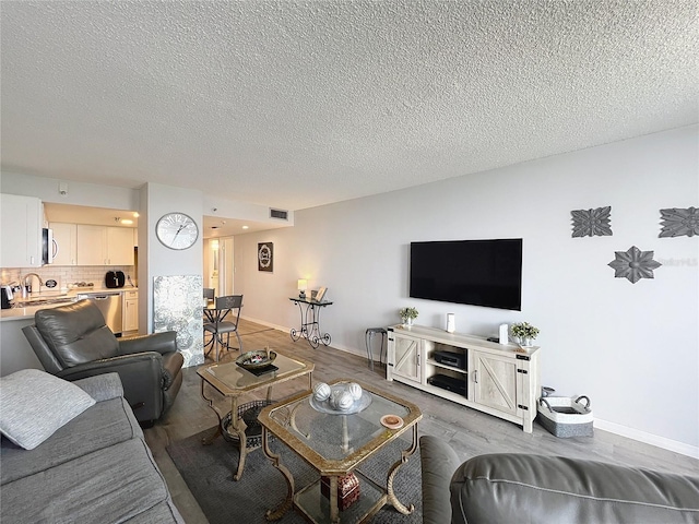 400 E Colonial Dr Unit 1501, Orlando, FL 32803 - living area with wood finished floors and a textured ceiling