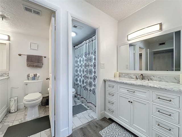 400 E Colonial Dr Unit 1501, Orlando, FL 32803 - bathroom featuring a textured ceiling, vanity, and a shower with curtain