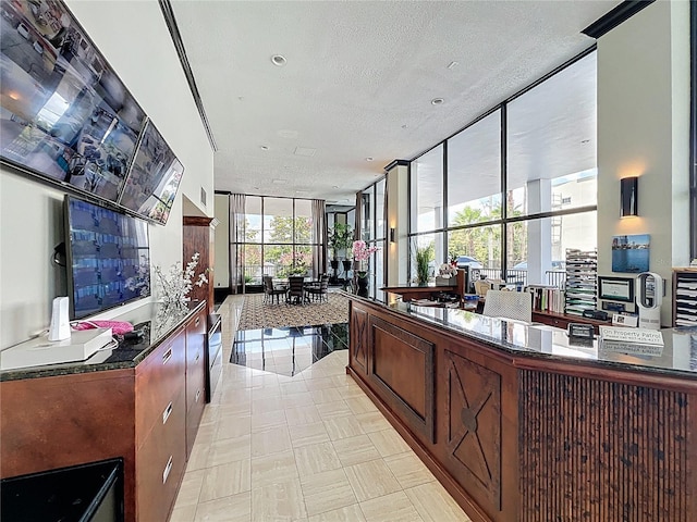 400 E Colonial Dr Unit 1501, Orlando, FL 32803 - bar featuring floor to ceiling windows and a textured ceiling