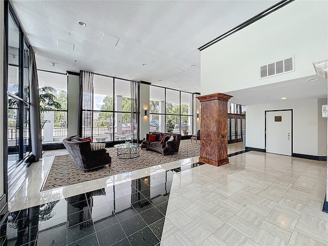 400 E Colonial Dr Unit 1501, Orlando, FL 32803 - common area with a wall of windows and a textured ceiling