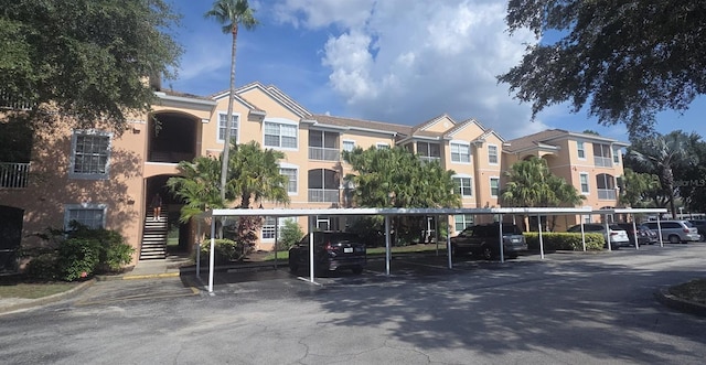 13584 Turtle Marsh Loop Unit 12, Orlando, FL 32837 - view of building exterior with covered parking