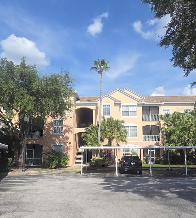 13584 Turtle Marsh Loop Unit 12, Orlando, FL 32837 - view of property with covered parking