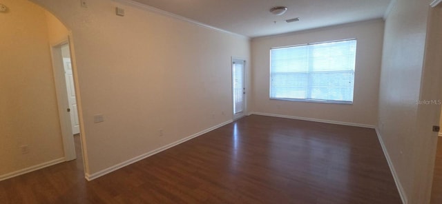 13584 Turtle Marsh Loop Unit 12, Orlando, FL 32837 - empty room featuring arched walkways, wood finished floors, and ornamental molding