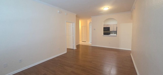 13584 Turtle Marsh Loop Unit 12, Orlando, FL 32837 - unfurnished room with dark wood-type flooring, crown molding, and arched walkways