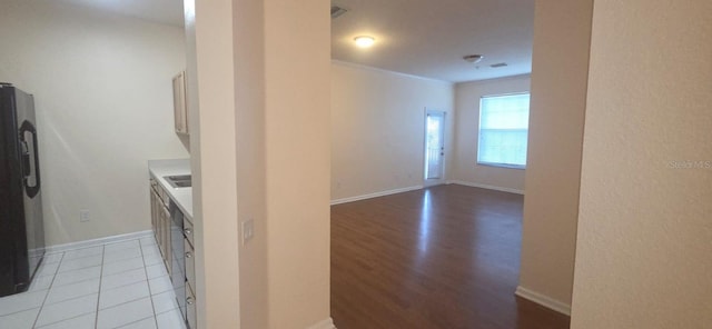 13584 Turtle Marsh Loop Unit 12, Orlando, FL 32837 - kitchen featuring refrigerator with ice dispenser, light countertops, and light wood-style floors
