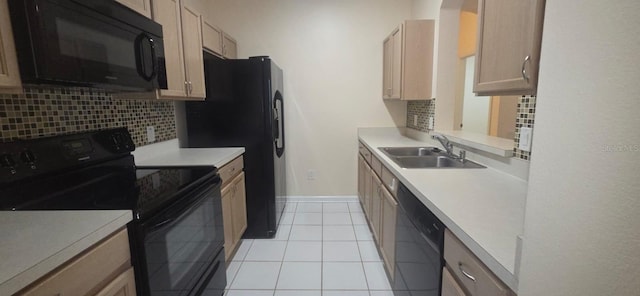 13584 Turtle Marsh Loop Unit 12, Orlando, FL 32837 - kitchen with black appliances, decorative backsplash, light countertops, and light tile patterned floors