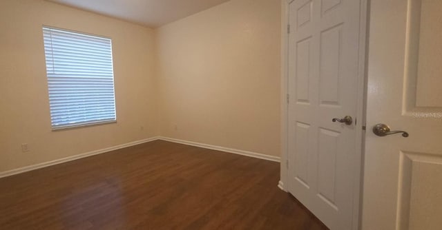13584 Turtle Marsh Loop Unit 12, Orlando, FL 32837 - spare room with dark wood-type flooring and baseboards