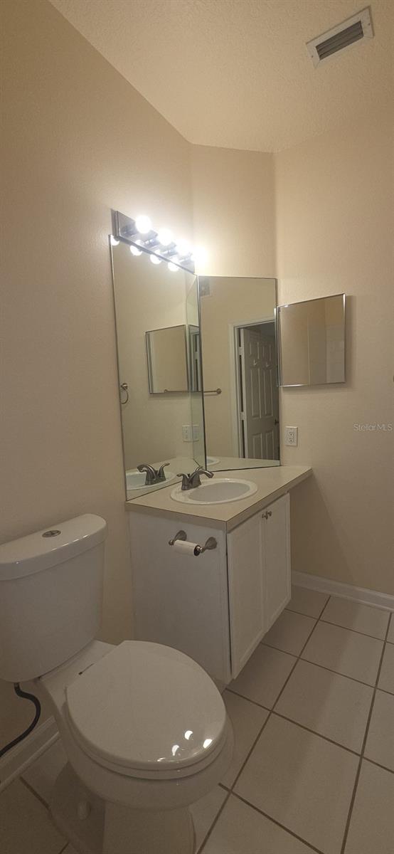 13584 Turtle Marsh Loop Unit 12, Orlando, FL 32837 - bathroom featuring tile patterned floors and vanity
