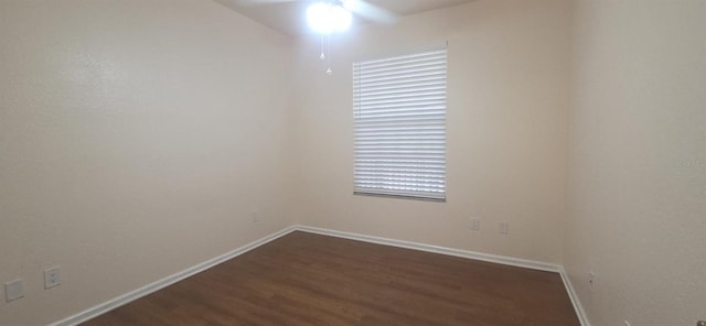 13584 Turtle Marsh Loop Unit 12, Orlando, FL 32837 - empty room with ceiling fan and dark wood-style floors