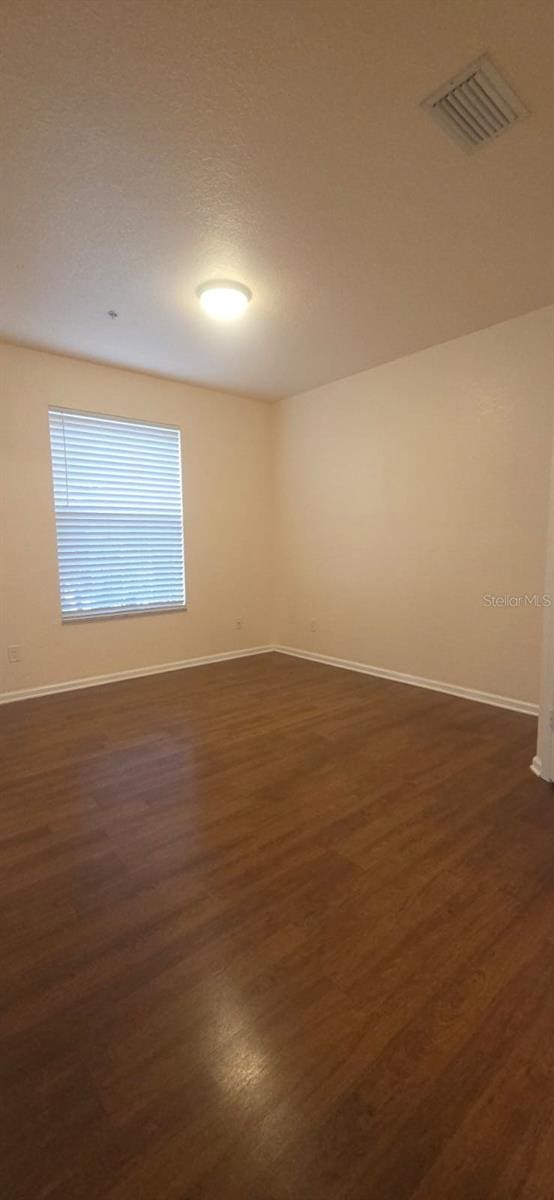 13584 Turtle Marsh Loop Unit 12, Orlando, FL 32837 - empty room featuring dark wood finished floors