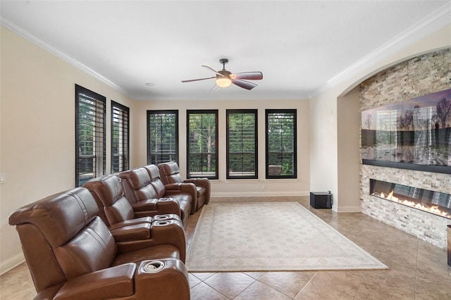 25554 Hawks Run Ln, Sorrento, FL 32776 - tiled living area with crown molding, ceiling fan, and a fireplace