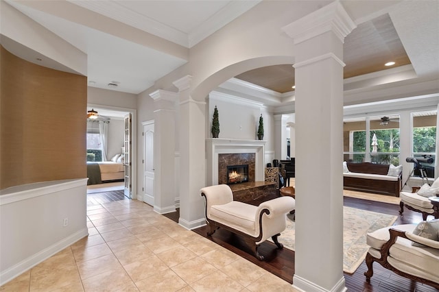 25554 Hawks Run Ln, Sorrento, FL 32776 - living area with decorative columns, a ceiling fan, healthy amount of natural light, and ornamental molding