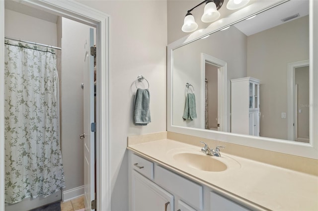 25554 Hawks Run Ln, Sorrento, FL 32776 - bathroom with vanity, a shower with shower curtain, and tile patterned floors