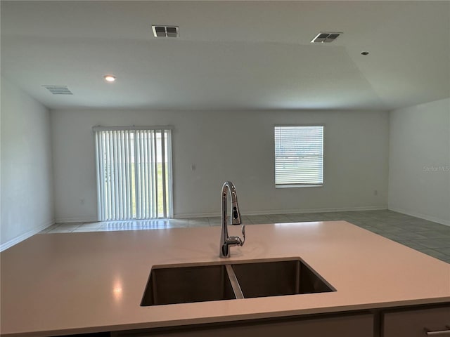 1950 Birnham Wood Bnd, Kissimmee, FL 34746 - kitchen with open floor plan, light countertops, light tile patterned flooring, and recessed lighting