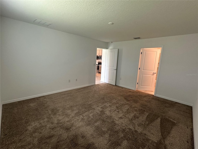 1950 Birnham Wood Bnd, Kissimmee, FL 34746 - unfurnished bedroom featuring carpet floors and a textured ceiling