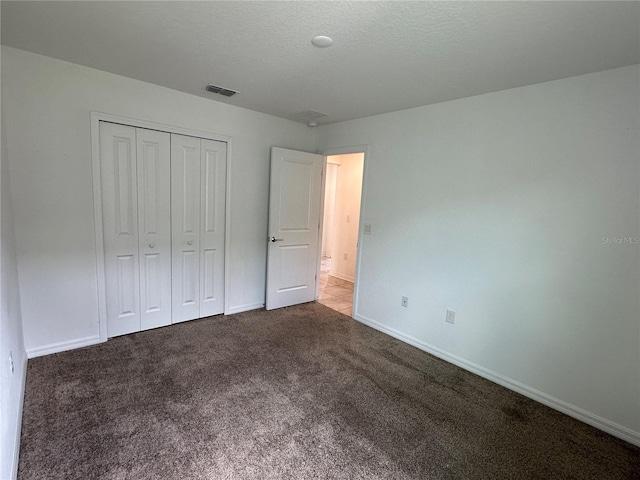 1950 Birnham Wood Bnd, Kissimmee, FL 34746 - unfurnished bedroom with carpet floors and a closet