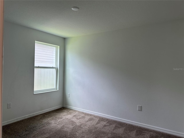 1950 Birnham Wood Bnd, Kissimmee, FL 34746 - spare room featuring baseboards and carpet flooring