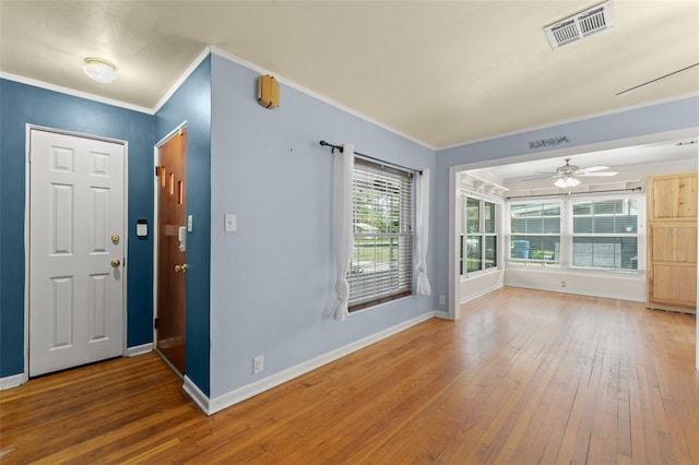 2538 Meadowview Ln, Deland, FL 32720 - entrance foyer featuring wood-type flooring, ornamental molding, and a ceiling fan