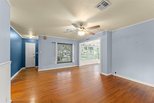 2538 Meadowview Ln, Deland, FL 32720 - unfurnished living room with a ceiling fan, wood-type flooring, and ornamental molding