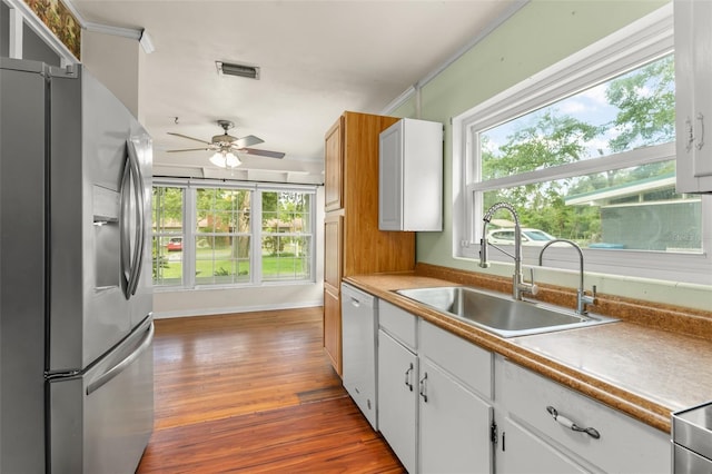 2538 Meadowview Ln, Deland, FL 32720 - kitchen with stainless steel refrigerator with ice dispenser, dark wood-style flooring, healthy amount of natural light, and ceiling fan